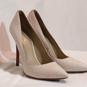 Coach white embossed leather pumps